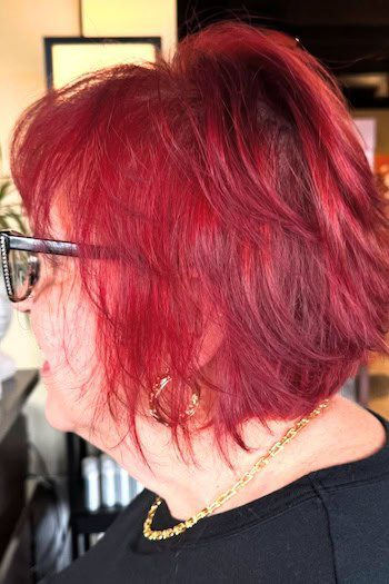 Vibrant red textured layered bob haircut
