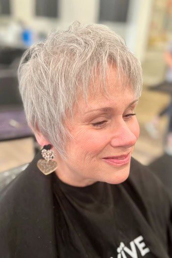 Short silver pixie with textured bangs