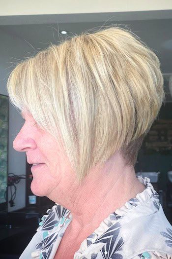Short angled blonde bob with bangs