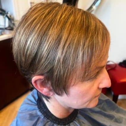 Blended brunette pixie with bangs and long sides