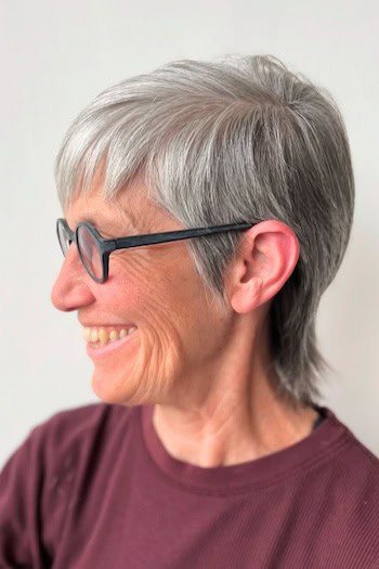 Side-swept gray pixie with long back