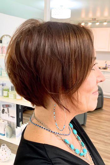 Short tapered brown bob with layers