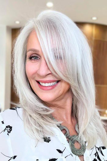 Layered silver lob with long side-swept bangs