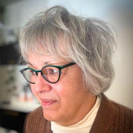 Short wispy layered gray bob with bangs