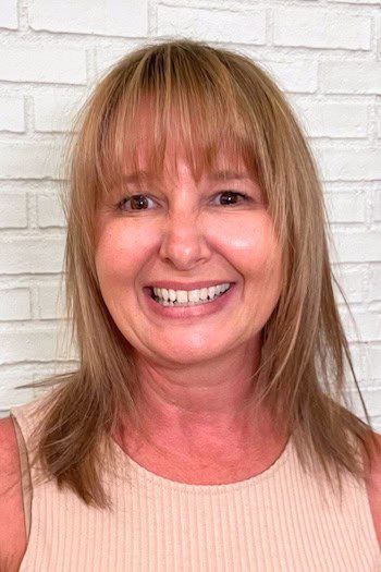 Medium-length layered cut with rounded bangs