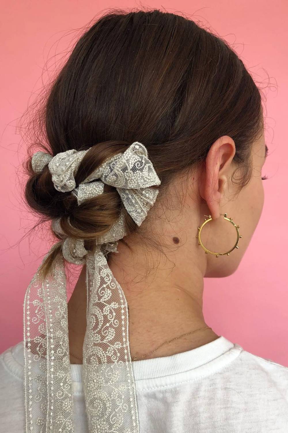 Braided low bun with ribbon