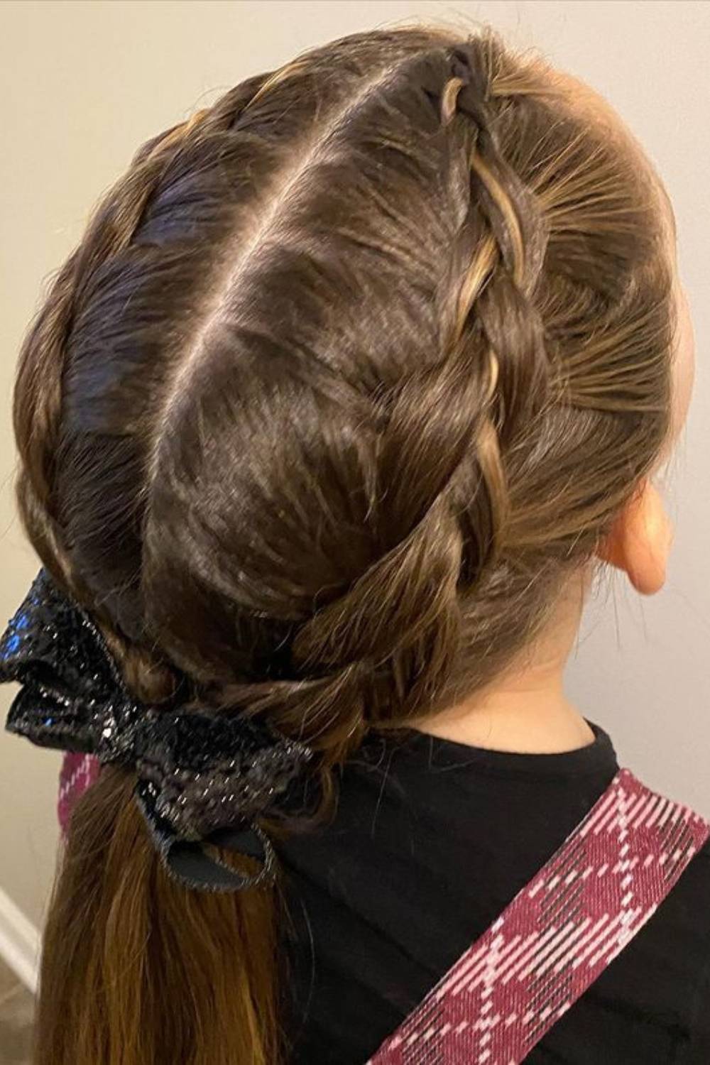 Double Dutch braids into ponytails