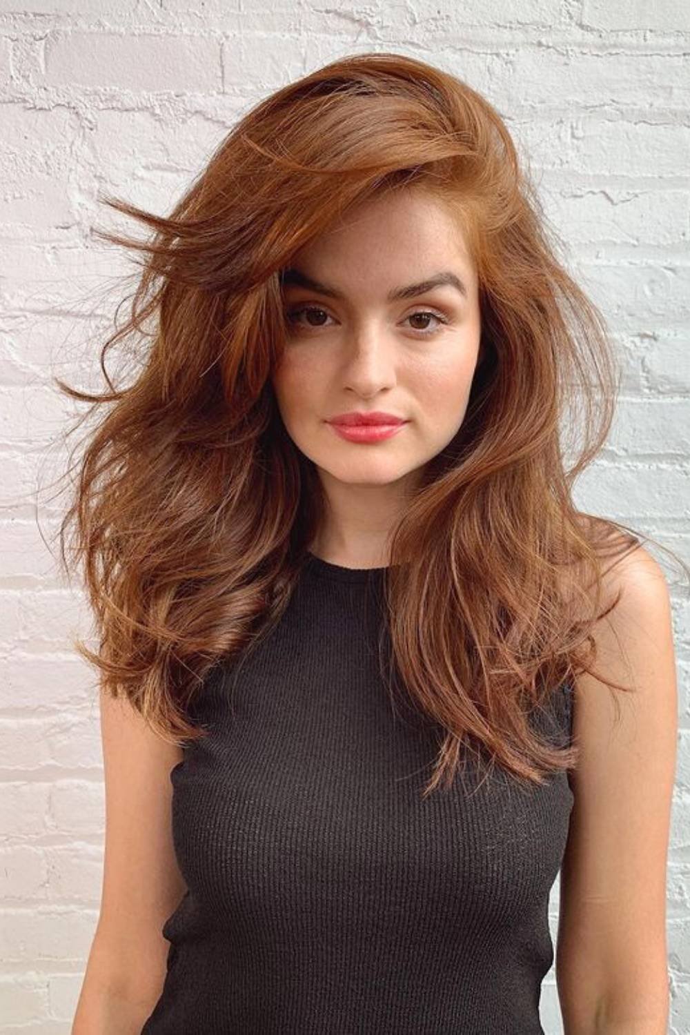 Voluminous cascading curls with natural texture and movement