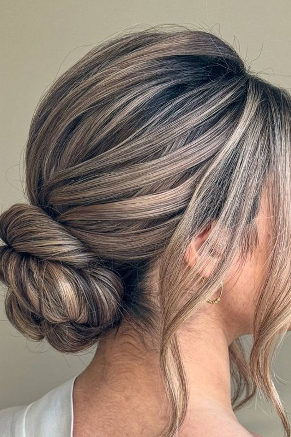 Sophisticated twisted bun with multiple intertwining sections