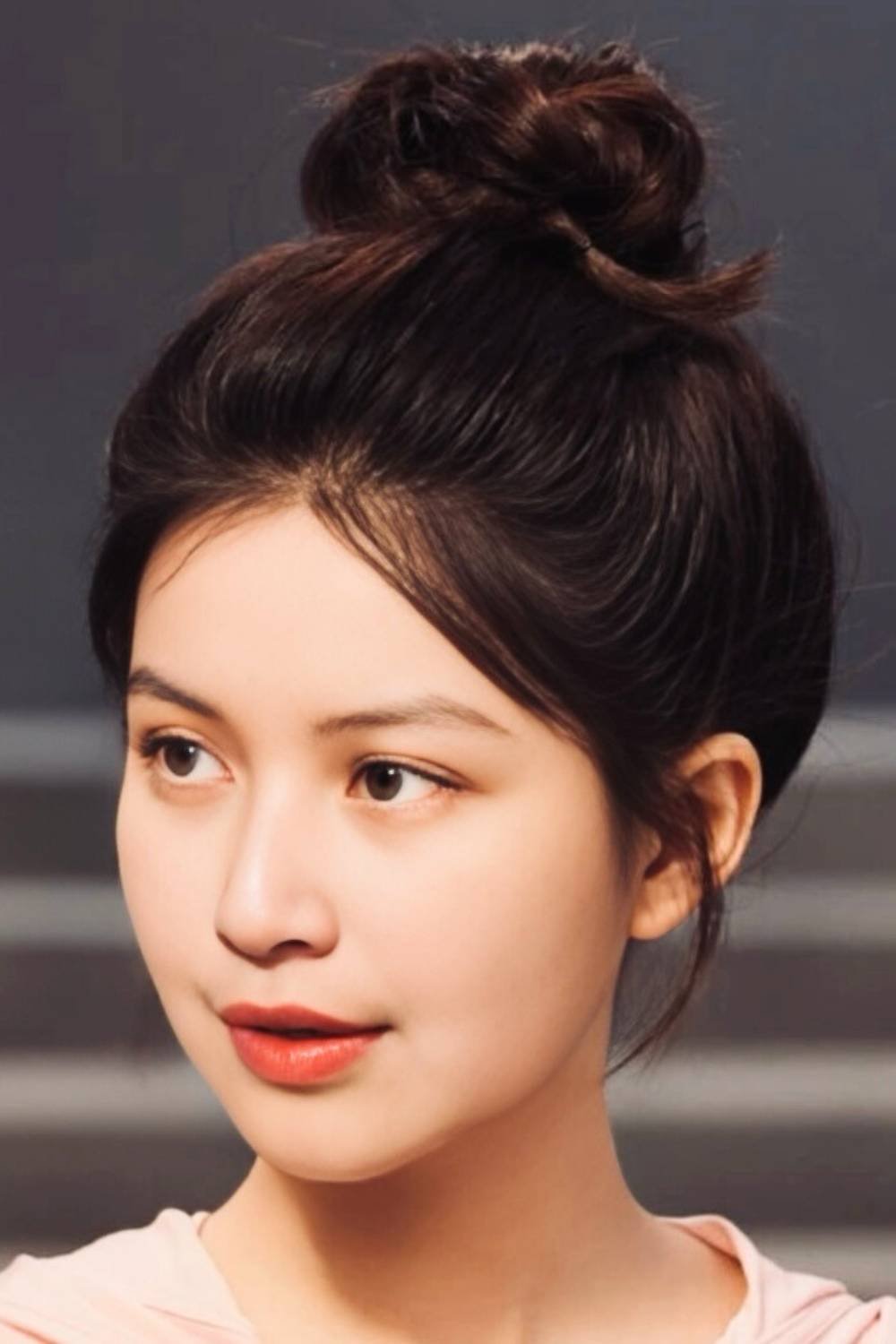 Messy bun hairstyle with decorative twist detail