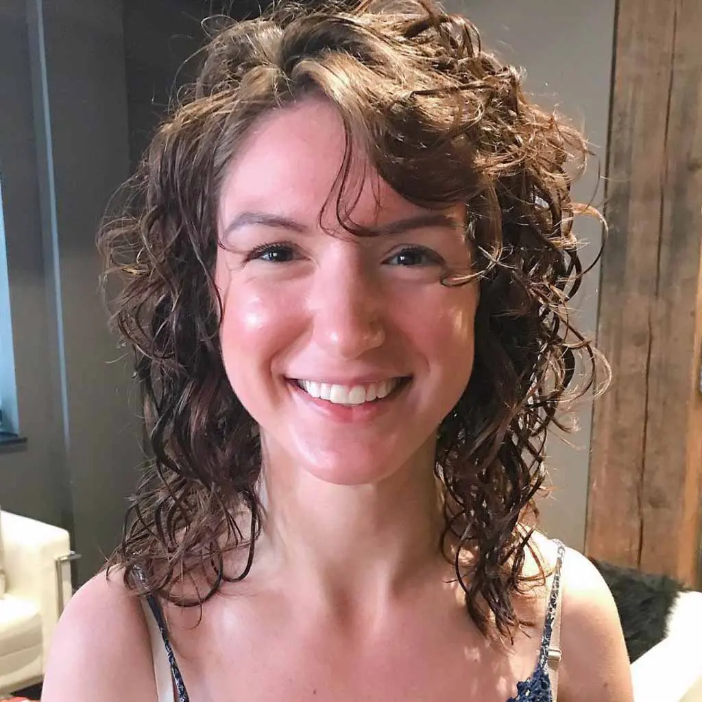 Curly Shag With Side-Swept Bangs for Fine Hair