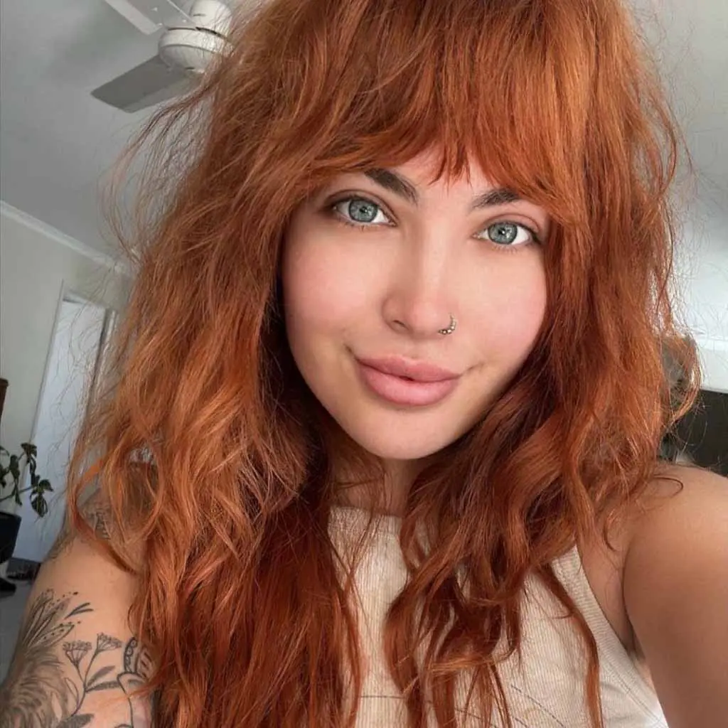 Long Ginger Shag With Asymmetric Bangs for Fine Hair