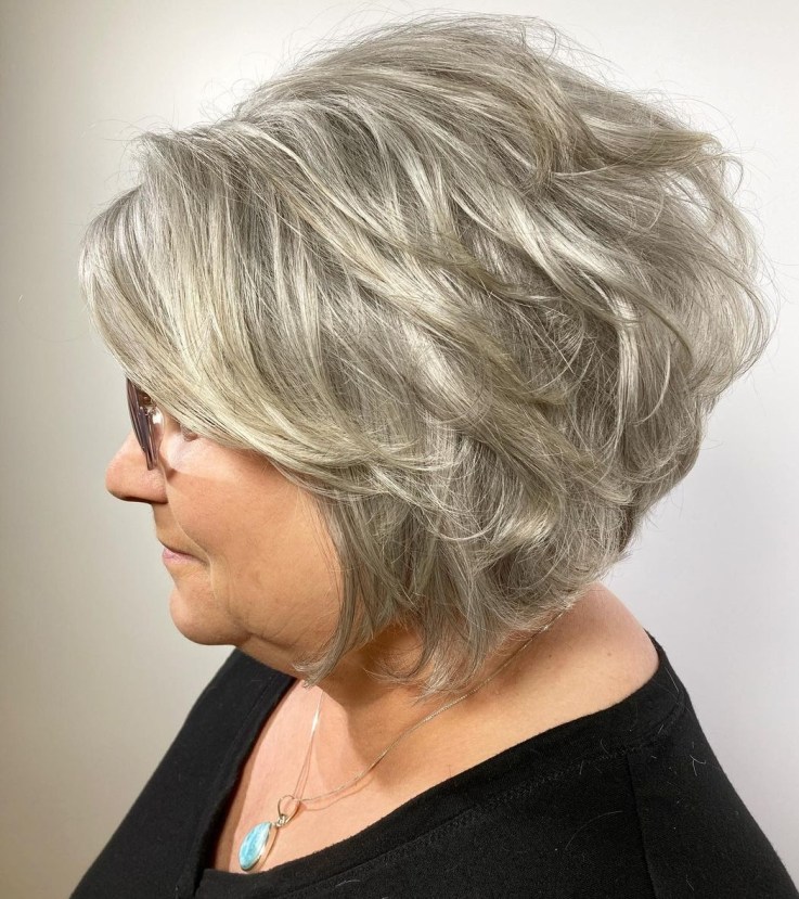 Inverted Bob with Side-Swept Bangs and Wavy Finish