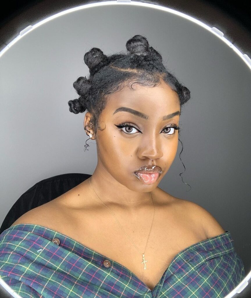 Bantu knots with styled edges on natural hair