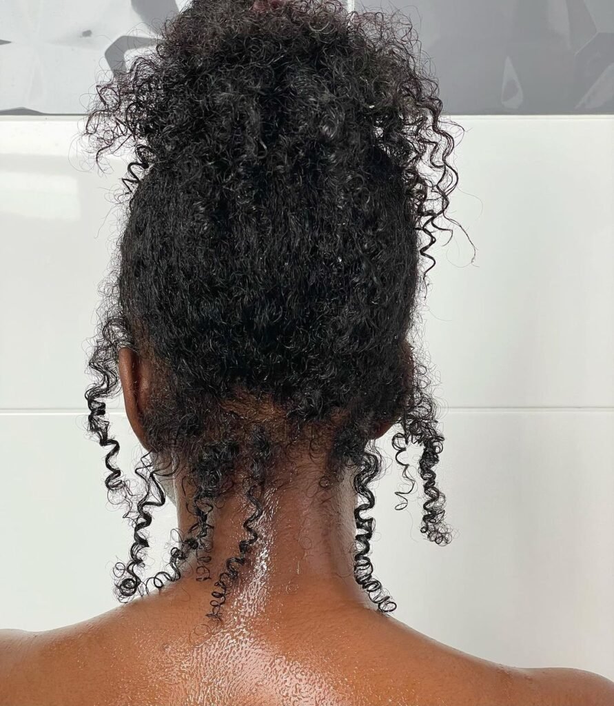 Messy curly updo on natural hair
